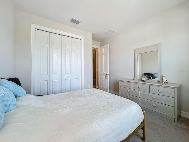 carpeted bedroom featuring a closet