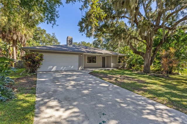 single story home with a front lawn and a garage