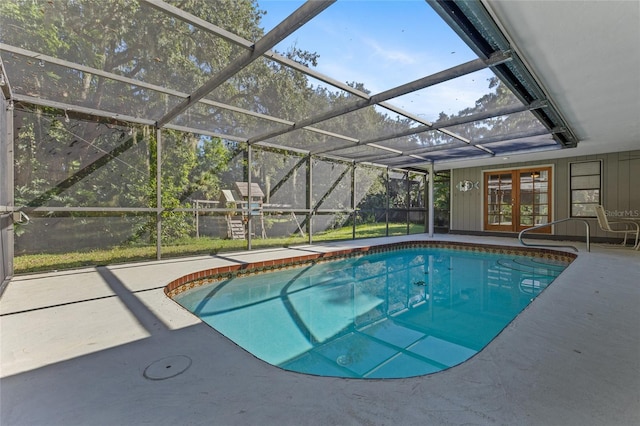 view of swimming pool with a lanai and a patio