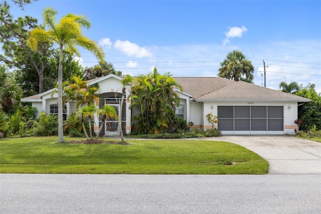 single story home with a front lawn and a garage