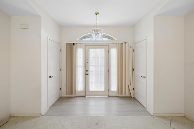 entrance foyer featuring a chandelier and light hardwood / wood-style flooring