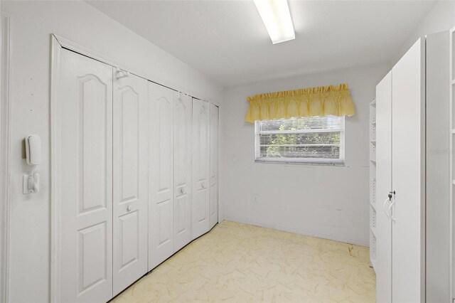 unfurnished bedroom featuring a closet