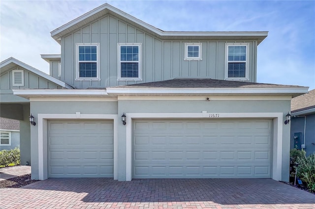 view of front of property with a garage