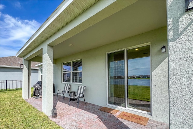 view of patio / terrace featuring a water view