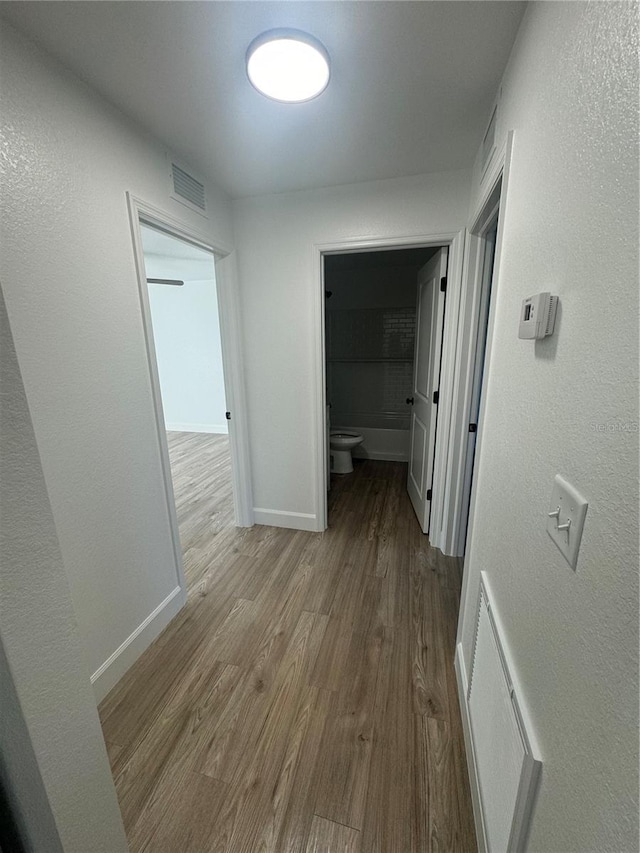 hallway featuring light hardwood / wood-style flooring