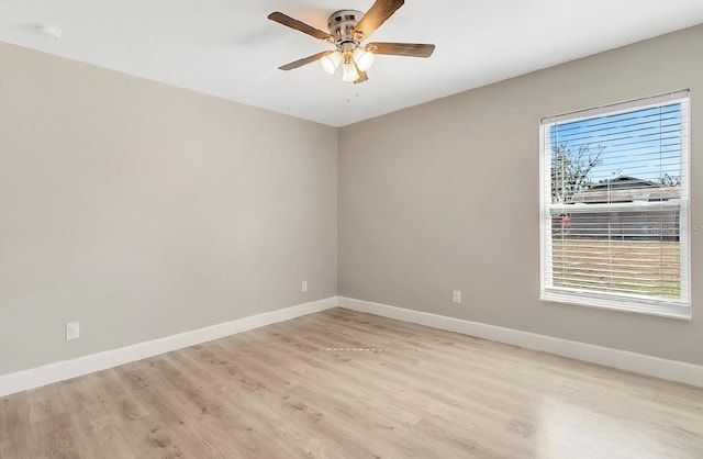 spare room featuring light hardwood / wood-style floors and ceiling fan