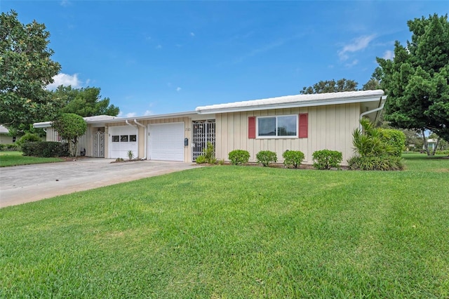 ranch-style home with a front yard and a garage