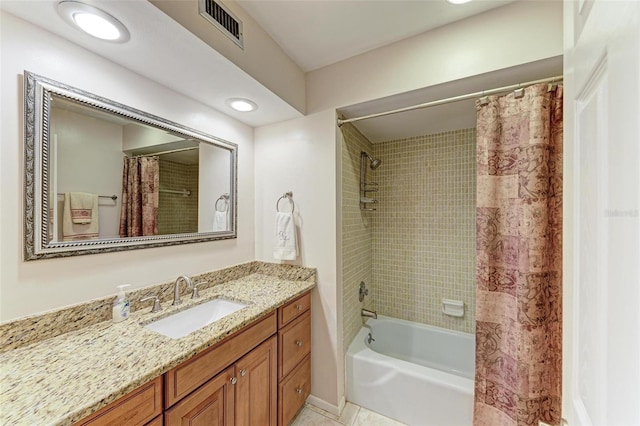 bathroom featuring shower / tub combo, tile patterned floors, and vanity