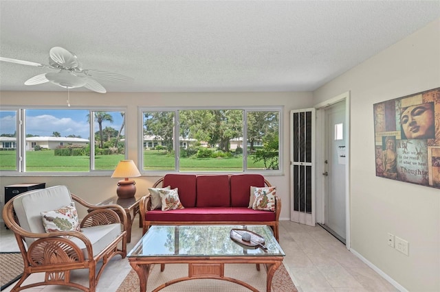 sunroom / solarium with ceiling fan