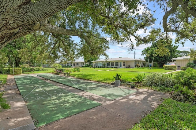 view of home's community with a lawn