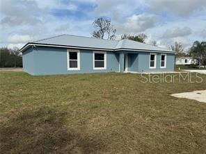 view of front of property with a front lawn
