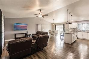 living room with a ceiling fan, dark wood-style floors, and lofted ceiling