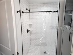 bathroom with a shower with shower door