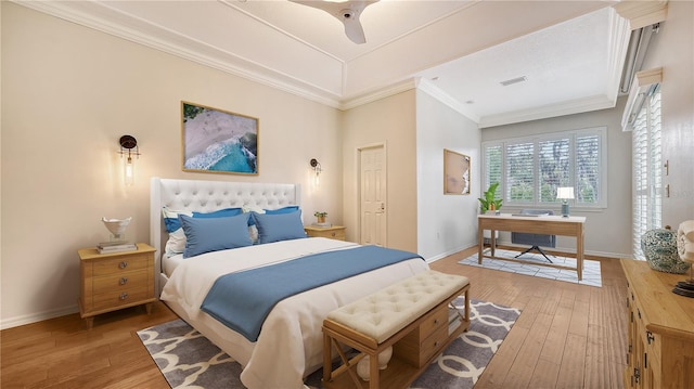 bedroom featuring ceiling fan, hardwood / wood-style flooring, and crown molding