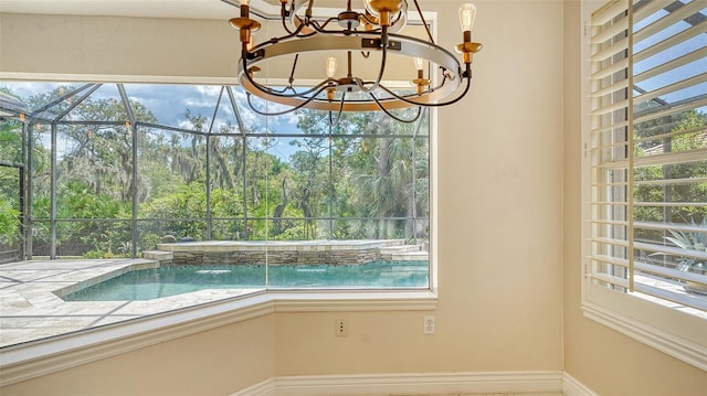 view of pool with a notable chandelier and pool water feature