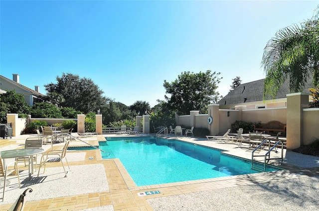 view of swimming pool featuring a patio area