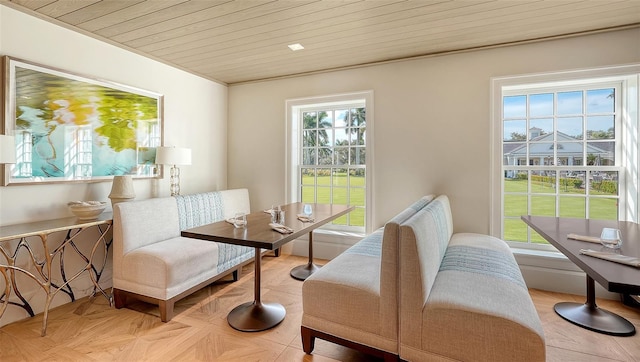 living area featuring light parquet floors and wooden ceiling