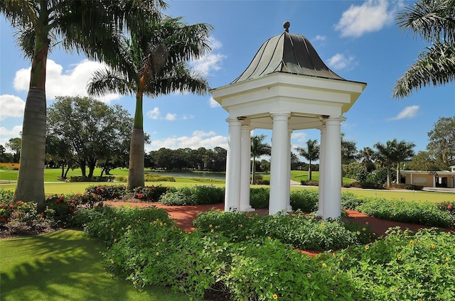 view of property's community with a lawn