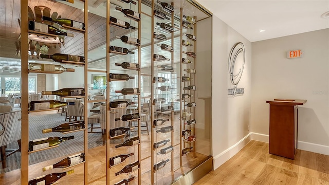 wine area with light wood-type flooring