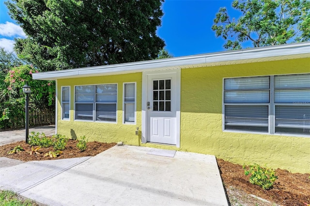 property entrance with a patio