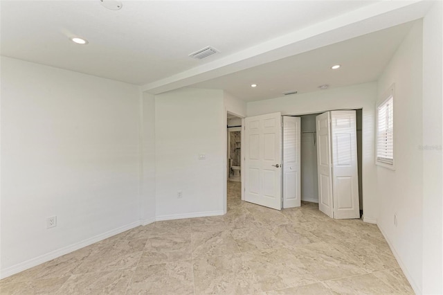 unfurnished bedroom featuring a closet