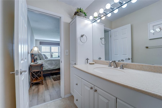 bathroom featuring wood-type flooring and vanity