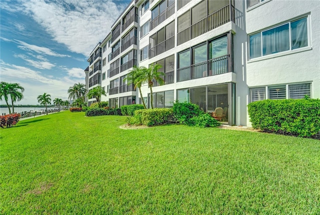 view of property's community with a yard