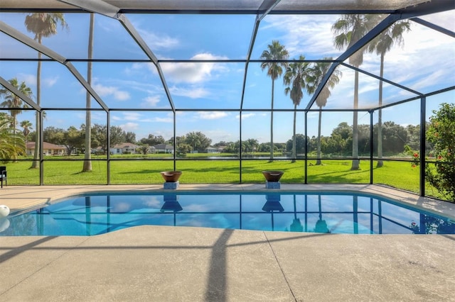 view of pool with a lawn, a lanai, and a patio area