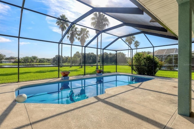 view of swimming pool with a lanai, a patio, and a yard