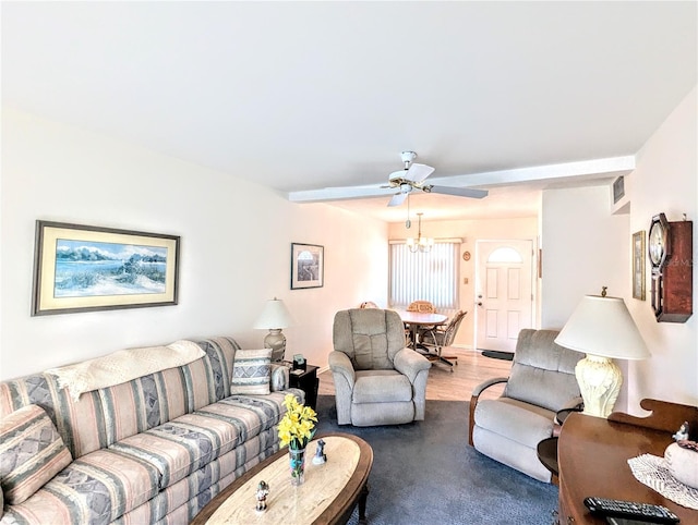 living room featuring ceiling fan and hardwood / wood-style flooring