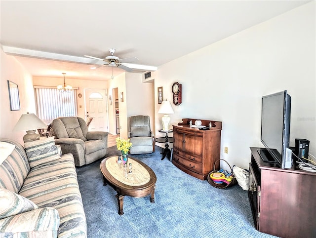 carpeted living room with ceiling fan with notable chandelier