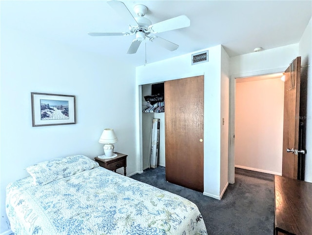 bedroom featuring ceiling fan, dark carpet, and a closet