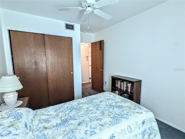 carpeted bedroom with a closet and ceiling fan