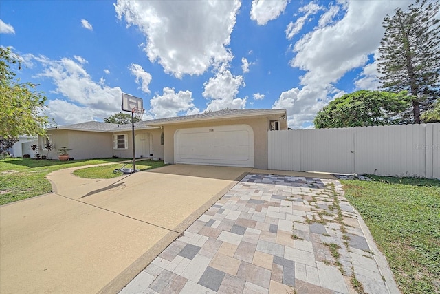 view of front of house featuring a front yard and a garage