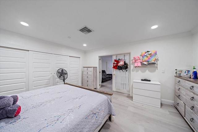 bedroom featuring light hardwood / wood-style flooring and ornamental molding