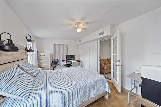 bedroom with ceiling fan and french doors