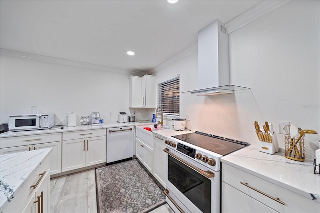 kitchen with crown molding, white appliances, white cabinetry, and sink