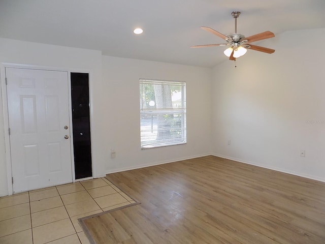 entryway with ceiling fan and light hardwood / wood-style floors