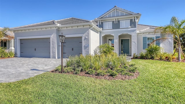 view of front facade with a front yard and a garage