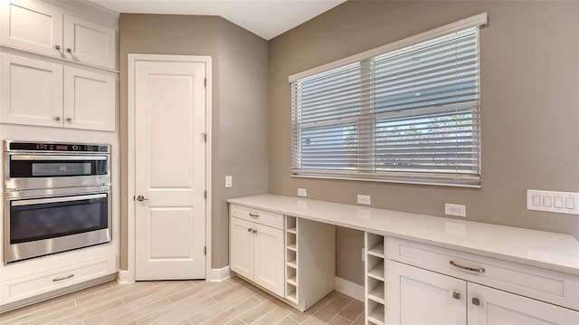 kitchen with white cabinetry and double oven