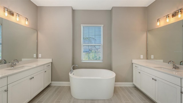 bathroom with a bathtub and vanity