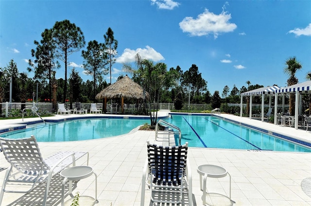 view of swimming pool with a gazebo and a patio