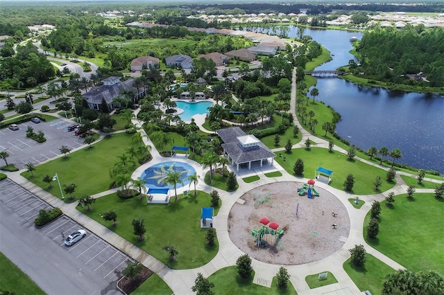 birds eye view of property with a water view