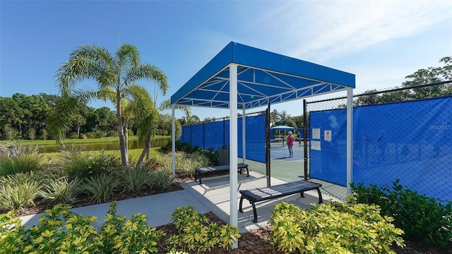 view of patio featuring tennis court