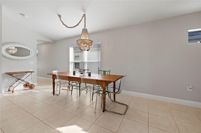 tiled dining area featuring vaulted ceiling and a notable chandelier