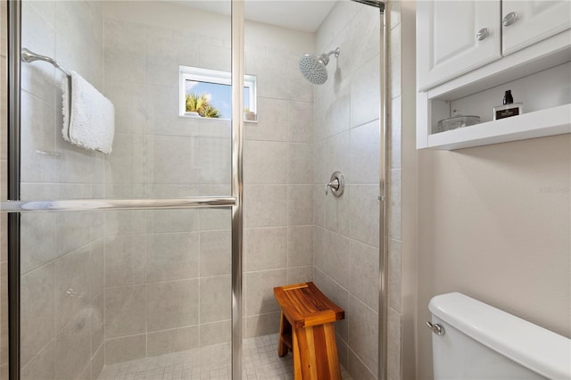 bathroom with toilet and walk in shower