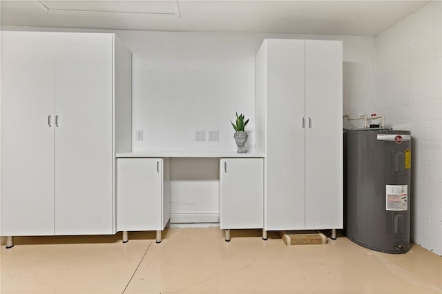 interior space featuring white cabinetry and water heater