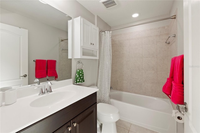 full bathroom with tile patterned floors, vanity, shower / bath combination with curtain, and toilet