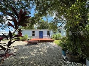 rear view of house with a wooden deck