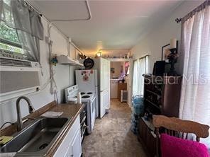 kitchen with white cabinets and sink